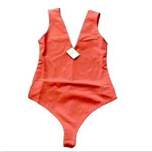 Free people, keep it sleek bodysuit. New with tags.